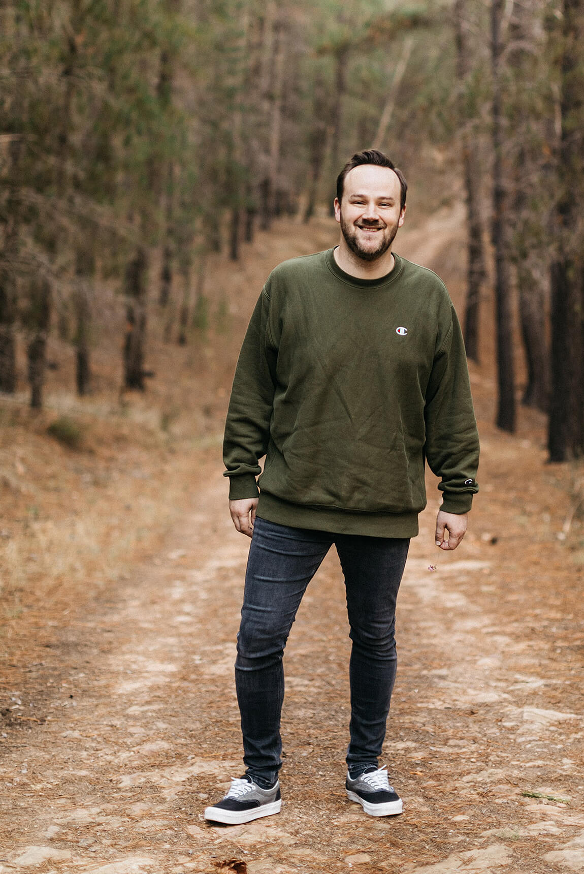 Ché Stevenson, Founder and Creative Director of Creative Revolution, relaxing with a stroll in a pine forest.