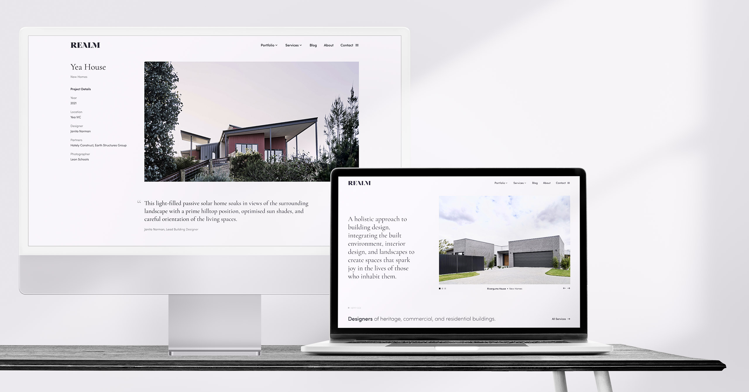 Realm Building Design Echuca website mockup on desktop computers on desk