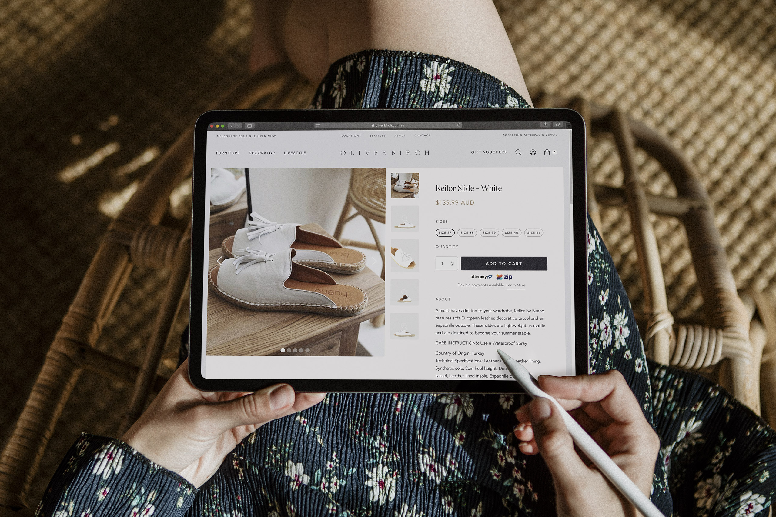 Oliver Birch product page design on iPad in woman's lap